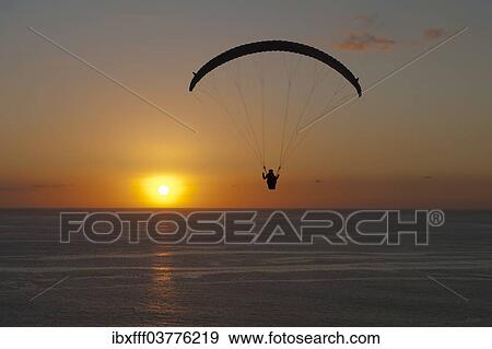 "Paraglider over the Atlantic Ocean with sunset, Canary Islands, Spain, Europe" View Large Photo Image Stock Photo - "Paraglider over the Atlantic Ocean with sunset, Canary Islands, Spain, Europe". Fotosearch