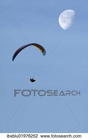 "Paraglider with moon, composing" View Large Photo Image Stock Image - "Paraglider with moon, composing". Fotosearch