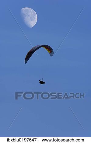 Paraglider with moon View Large Photo Image Stock Image - Paraglider with moon. Fotosearch