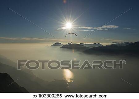 "Paragliding, clouds, inversions, Lake Garda, Veneto, Italy, Europe" View Large Photo Image Stock Photography - "Paragliding, clouds, inversions, Lake Garda, Veneto, Italy, Europe". Fotosearch
