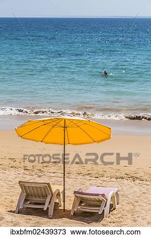 "Parasol and sun beds, beach Praia da Rocha, Portimao, Algarve, Atlantic, Portugal, Europe" View Large Photo Image Stock Image - "Parasol and sun beds, beach Praia da Rocha, Portimao, Algarve, Atlantic, Portugal, Europe". Fotosearch