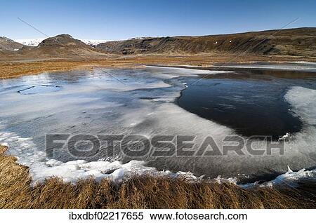 "Partly frozen lake near Dyrholaey, Myrdalsjoekull Glacier, south coast, Iceland, Europe" View Large Photo Image Stock Photography - "Partly frozen lake near Dyrholaey, Myrdalsjoekull Glacier, south coast, Iceland, Europe". Fotosearch