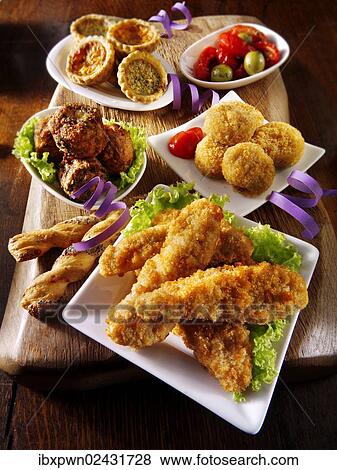 "Party buffet food with Southern fried chicken, onion balls, small quiches and fried Camembert" View Large Photo Image Stock Photo - "Party buffet food with Southern fried chicken, onion balls, small quiches and fried Camembert". Fotosearch