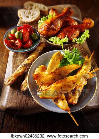 Party buffet with chicken satay and grilled chicken legs View Large Photo Image Stock Image - Party buffet with chicken satay and grilled chicken legs. Fotosearch