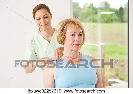Patient being treated on her shoulder by a physiotherapist View Large Photo Image Stock Photo - Patient being treated on her shoulder by a physiotherapist. Fotosearch
