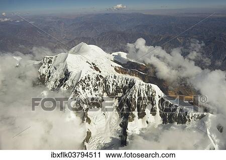 "Peak of the Illimani Glacier, 6439 m, view from an aircraft, Departamento La Paz, Bolivia, South America" View Large Photo Image Stock Image - "Peak of the Illimani Glacier, 6439 m, view from an aircraft, Departamento La Paz, Bolivia, South America". Fotosearch