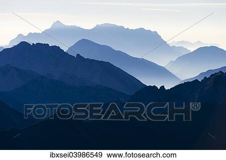 Stock Photo - "Peaks of the Allgau Alps in steplike arrangement in the early morning, Oberstdorf, Bavaria, Germany, Europe". Fotosearch