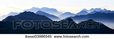 "Peaks of the Allgau Alps in steplike arrangement in the early morning, Oberstdorf, Bavaria, Germany, Europe" View Large Photo Image Stock Photography - "Peaks of the Allgau Alps in steplike arrangement in the early morning, Oberstdorf, Bavaria, Germany, Europe". Fotosearch