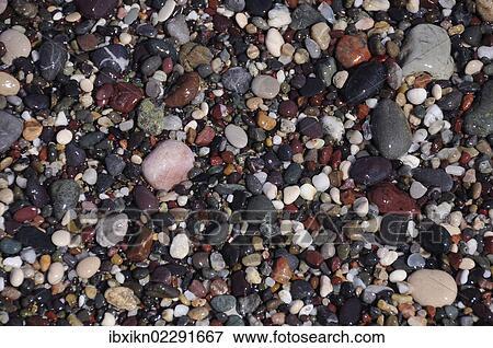 Pebbles on the beach View Large Photo Image Stock Photo - Pebbles on the beach. Fotosearch