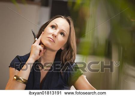 Stock Image - Pensive woman. Fotosearch