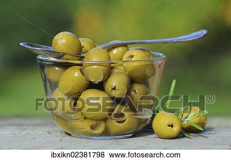 Pickled olives in a glass bowl View Large Photo Image Stock Photo - Pickled olives in a glass bowl. Fotosearch