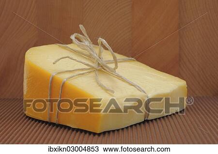 "Piece of cheese wrapped with twine, Germany, Europe" View Large Photo Image Stock Image - "Piece of cheese wrapped with twine, Germany, Europe". Fotosearch