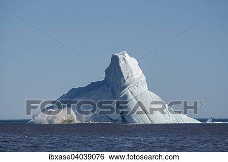 "Pieces breaking off an enormous iceberg causing it to unbalance and collapse, Qeqertarsuaq, Disko Bay, Greenland, North America" View Large Photo Image Stock Photograph - "Pieces breaking off an enormous iceberg causing it to unbalance and collapse, Qeqertarsuaq, Disko Bay, Greenland, North America". Fotosearch