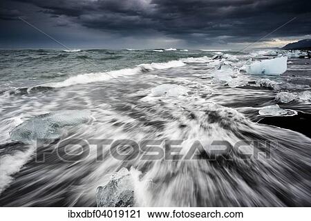 "Pieces of ice on black beach lapped by the sea, at the Jokulsarlon glacier lagoon, Vatnajokull Glacier, Eastern Region, Iceland, Europe" View Large Photo Image Stock Image - "Pieces of ice on black beach lapped by the sea, at the Jokulsarlon glacier lagoon, Vatnajokull Glacier, Eastern Region, Iceland, Europe". Fotosearch