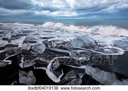"Pieces of ice on black beach lapped by the sea, at the Jokulsarlon glacier lagoon, Vatnajokull Glacier, Eastern Region, Iceland, Europe" View Large Photo Image Stock Photo - "Pieces of ice on black beach lapped by the sea, at the Jokulsarlon glacier lagoon, Vatnajokull Glacier, Eastern Region, Iceland, Europe". Fotosearch