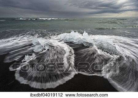 "Pieces of ice on the black beach lapped by the sea, at Jokulsarlon Glacial Lagoon, Vatnajokull Glacier, Eastern Region, Iceland, Europe" View Large Photo Image Stock Image - "Pieces of ice on the black beach lapped by the sea, at Jokulsarlon Glacial Lagoon, Vatnajokull Glacier, Eastern Region, Iceland, Europe". Fotosearch