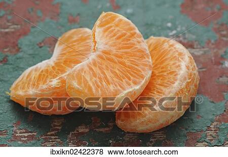 Pieces of mandarine View Large Photo Image Stock Photo - Pieces of mandarine. Fotosearch