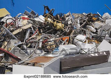 Stock Photography - "Pile of discarded household and industrial items at a scrap metal recycling centre, Quebec, Canada, North America". Fotosearch
