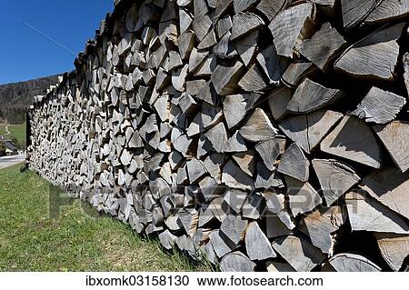 Stock Image - "Piled-up firewood, logs, Ried am Wolfgangsee, Salzburg State, Austria, Europe". Fotosearch
