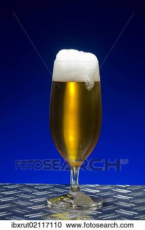 "Pilsener beer, beer with a head in a traditional pils glass, on metal table" View Large Photo Image Stock Image - "Pilsener beer, beer with a head in a traditional pils glass, on metal table". Fotosearch