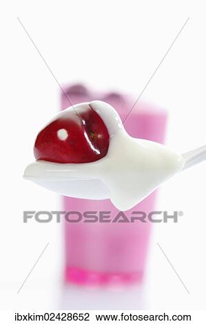 Pink cup and white plastic spoon with yogurt and cherry View Large Photo Image Stock Image - Pink cup and white plastic spoon with yogurt and cherry. Fotosearch