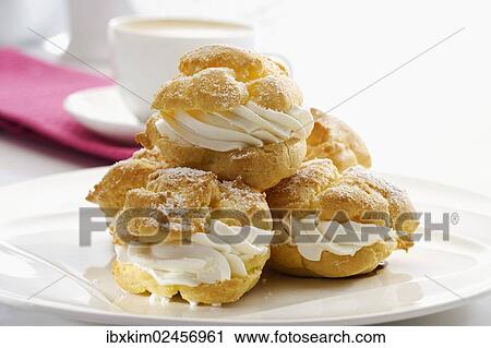 "Plate of cream puffs, choux pastry filled with cream" View Large Photo Image Stock Image - "Plate of cream puffs, choux pastry filled with cream". Fotosearch