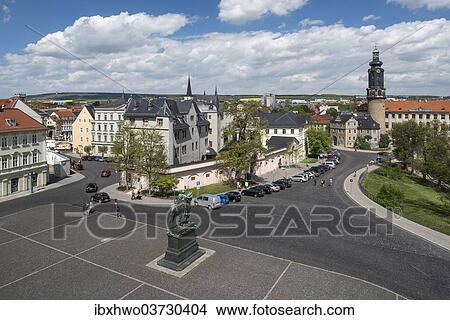 Picture - "Platz der Demokratie square with Carl August monument, at the center study center of the Duchess Anna Amalia Library, rear right City Castle, Weimar, Thuringia, Germany, Europe". Fotosearch
