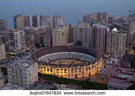 Picture - "Plaza de Toros, bullfighting arena, in the La Malagueta district of Malaga in between skyscrapers, as seen from Monte Gibrafaro, Malaga Andalusia, Costa del Sol, Southern Spain, Spain, Europe". Fotosearch