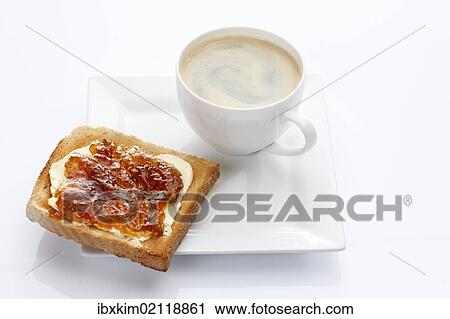 Porcelain plate with a cup of coffee and toast with apricot jam View Large Photo Image Stock Image - Porcelain plate with a cup of coffee and toast with apricot jam. Fotosearch
