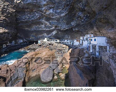 "Poris de Candelaria, houses in a cave, rocky coast on the Camino del Poris, Pirate's Cove, Tijarafe, La Palma, Canary Islands, Spain, Europe" View Large Photo Image Stock Image - "Poris de Candelaria, houses in a cave, rocky coast on the Camino del Poris, Pirate's Cove, Tijarafe, La Palma, Canary Islands, Spain, Europe". Fotosearch