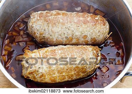 Pork roulade in a net in a casserole pot View Large Photo Image Stock Image - Pork roulade in a net in a casserole pot. Fotosearch