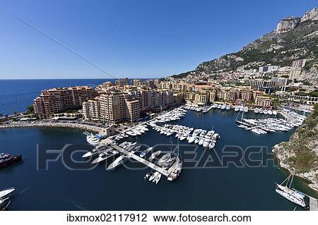 Stock Image - "Port Fontvieille harbour, Monaco-Fontvieille, Monte Carlo, principality of Monaco, Cote d'Azur, Mediterranean, Europe, PublicGround". Fotosearch