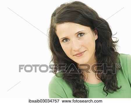 Stock Photo - "Portrait, young woman wearing a green shirt". Fotosearch