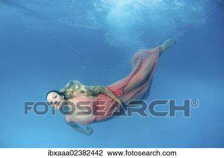 "Pregnant woman, underwater fashion in a pool" View Large Photo Image Stock Image - "Pregnant woman, underwater fashion in a pool". Fotosearch