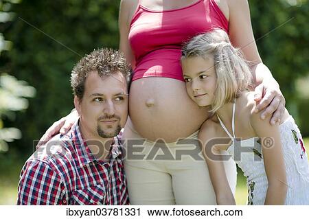 "Pregnant woman with husband and daughter, Austria, Europe" View Large Photo Image Stock Image - "Pregnant woman with husband and daughter, Austria, Europe". Fotosearch