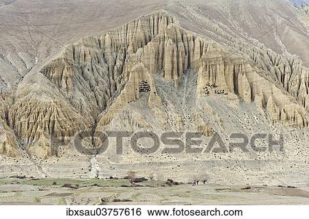 "Prehistoric caves in a bizarre erosion landscape, near Ghami, Upper Mustang, Lo, Nepal, Asia" View Large Photo Image Stock Photograph - "Prehistoric caves in a bizarre erosion landscape, near Ghami, Upper Mustang, Lo, Nepal, Asia". Fotosearch
