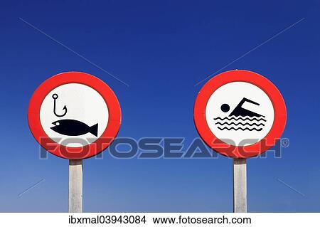 "Prohibition signs, no fishing and no swimming, port of Colonia de Sant Jordi, South Coast, Majorca, Balearic Islands, Spain, Europe" View Large Photo Image Picture - "Prohibition signs, no fishing and no swimming, port of Colonia de Sant Jordi, South Coast, Majorca, Balearic Islands, Spain, Europe". Fotosearch