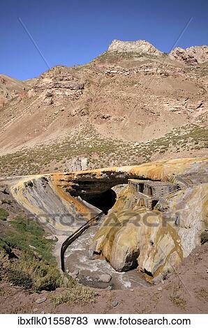 "Puente del Inca, tourist attraction, natural stone arch formed through erosion, the rocks are yellowish in colour because of sulfurous water hot springs, Argentine Andes near Mendoza, Argentina, South America" View Large Photo Image Stock Image - "Puente del Inca, tourist attraction, natural stone arch formed through erosion, the rocks are yellowish in colour because of sulfurous water hot springs, Argentine Andes near Mendoza, Argentina, South America". Fotosearch