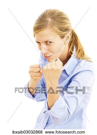 Pugnacious young woman with clenched fists View Large Photo Image Stock Photo - Pugnacious young woman with clenched fists. Fotosearch