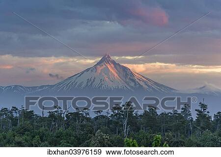 Stock Photo - "Puyehue volcano in the evening light, Puyehue, Los Lagos Region, Chile, South America". Fotosearch