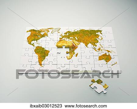 Stock Image - "Puzzle with world map, single puzzle piece lying apart". Fotosearch