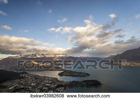 "Queenstown on Lake Wakatipu and The Remarkables mountain range at sunset, Otago Region, South Island, New Zealand, Oceania" View Large Photo Image Stock Photo - "Queenstown on Lake Wakatipu and The Remarkables mountain range at sunset, Otago Region, South Island, New Zealand, Oceania". Fotosearch