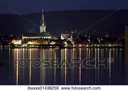Stock Photo - "Radolfzell skyline at night, from Iznang, Radolfzeller Muenster or Church of Our Lady, Zeller See lake, Untersee lake, Lake Constance, Radolfzell, Baden-Wuerttemberg, Germany, Europe". Fotosearch