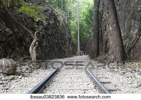 "Rail tracks ending, monument, memorial, Hellfire Pass, Konyu Cutting, Death Railway, part of the Burma Railway or Thailand? ÇôBurma Railway, Kanchanaburi Province, Central Thailand, Thailand, Asia" View Large Photo Image Stock Photograph - "Rail tracks ending, monument, memorial, Hellfire Pass, Konyu Cutting, Death Railway, part of the Burma Railway or Thailand? ÇôBurma Railway, Kanchanaburi Province, Central Thailand, Thailand, Asia". Fotosearch