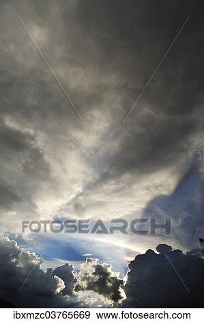 "Rain clouds with sun breaking through, Middle Franconia, Bavaria, Germany, Europe" View Large Photo Image Stock Photo - "Rain clouds with sun breaking through, Middle Franconia, Bavaria, Germany, Europe". Fotosearch