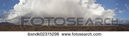 Stock Photo - "Rainbow in front of a huge backdrop of clouds in the Argentine highlands of the Andes Mountains, Uspallata, Mendoza region, Argentina, South America, Latin America, South America". Fotosearch