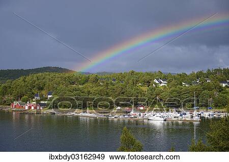 Stock Photo - "Rainbow over a port, Lauvsnes, Flatanger, Nord-Trondelag, Trondelag, Norway, Europe". Fotosearch