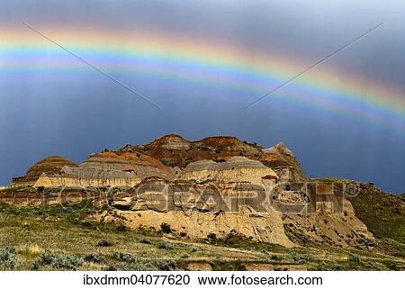 "Rainbow over colorful badlands, eroded rock formation of sedimentary rock, Dinosaur Provincial Park, UNESCO World Heritage Site, Alberta Province, Canada, North America" View Large Photo Image Stock Image - "Rainbow over colorful badlands, eroded rock formation of sedimentary rock, Dinosaur Provincial Park, UNESCO World Heritage Site, Alberta Province, Canada, North America". Fotosearch
