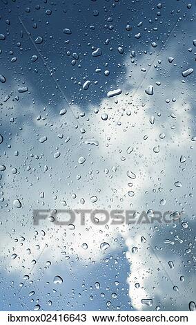 Raindrops on a window in front of storm clouds View Large Photo Image Stock Image - Raindrops on a window in front of storm clouds. Fotosearch