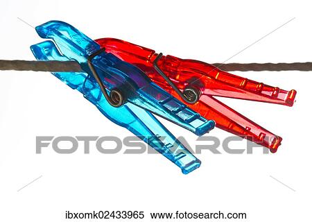 Red and blue pegs on a clothesline View Large Photo Image Stock Photography - Red and blue pegs on a clothesline. Fotosearch